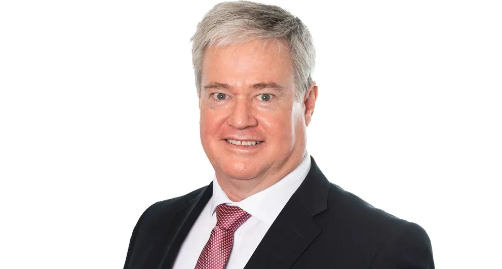 Mr Stephen Margetic wearing a suit.